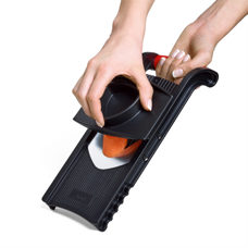 Coupe-légumes avec support pour restes de légumes 